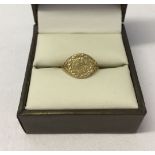 9ct gold small/childs ring, designed as a miniature sovereign. Size I. Weight approx 0.8g.