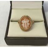 Ladies hallmarked 9ct gold cameo dress ring carved with the 3 muses. Size M. Weight approx 2.9g.