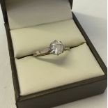 Dress ring with 9ct gold shank set with a large clear stone in a silver setting. Size approx Q.