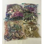 A box containing 5 bags of assorted costume jewellery, weight exceeds 4kg.