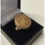 1910 half sovereign coin set in an ornate 9ct gold mount. Size N½, total ring. Weight approx 9.7g.