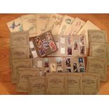 22 sets of vintage cigarette cards (15 sets loose in albums & 7 stuck into albums) - to include