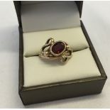 9ct gold & oval garnet dress ring in high fancy mount, size N, approx 4.2g total weight.