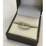 18ct gold ring set with 5 diamonds size R, approx 3.8g total weight. Total diamond carat weight