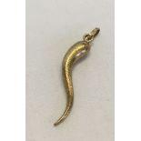 9ct gold 'Horn of Plenty' pendant. 5cm long, approx 2.7g.