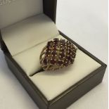 9ct gold & garnet cluster ring, 23 garnets, size P. Approx 5.9g total weight.