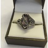 Silver & marcasite ring set with an oval amethyst. Size Q½.