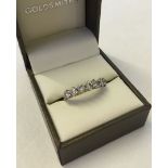 7 stone diamond half eternity ring set in 18ct gold. Approx 1.4ct diamond weight, Size P. Total