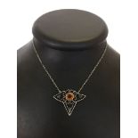 Vintage sterling silver necklace set with a large round citrine in an ornate Art Deco design