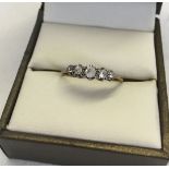 9ct gold & silver ring set with 5 diamonds. Size O, approx 1.2g total weight.