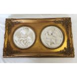 An Ornate framed double plaque of cherubs (52cm wide x 32cm high).