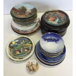 A large quantity of collectors plates to include Wedgwood, Davenport, Poole & Palissy.