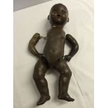 Vintage black German doll by Pomsons with bisque head and composition body. Needs restringing,