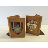 A pair of wooden bookends with RAF shield decoration.