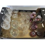 A quantity of glassware to include glasses, coloured glass urns and paperweights.