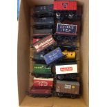 A box of 20 unboxed OO gauge railway trucks to include Raleigh Cycles.