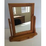 A pine dressing table mirror.