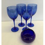 A Bristol Blue glass posy bowl with 4 large blue wine goblets.