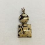 A 925 silver pendant with a round and square piece of leopard agate. Total length 5cm.