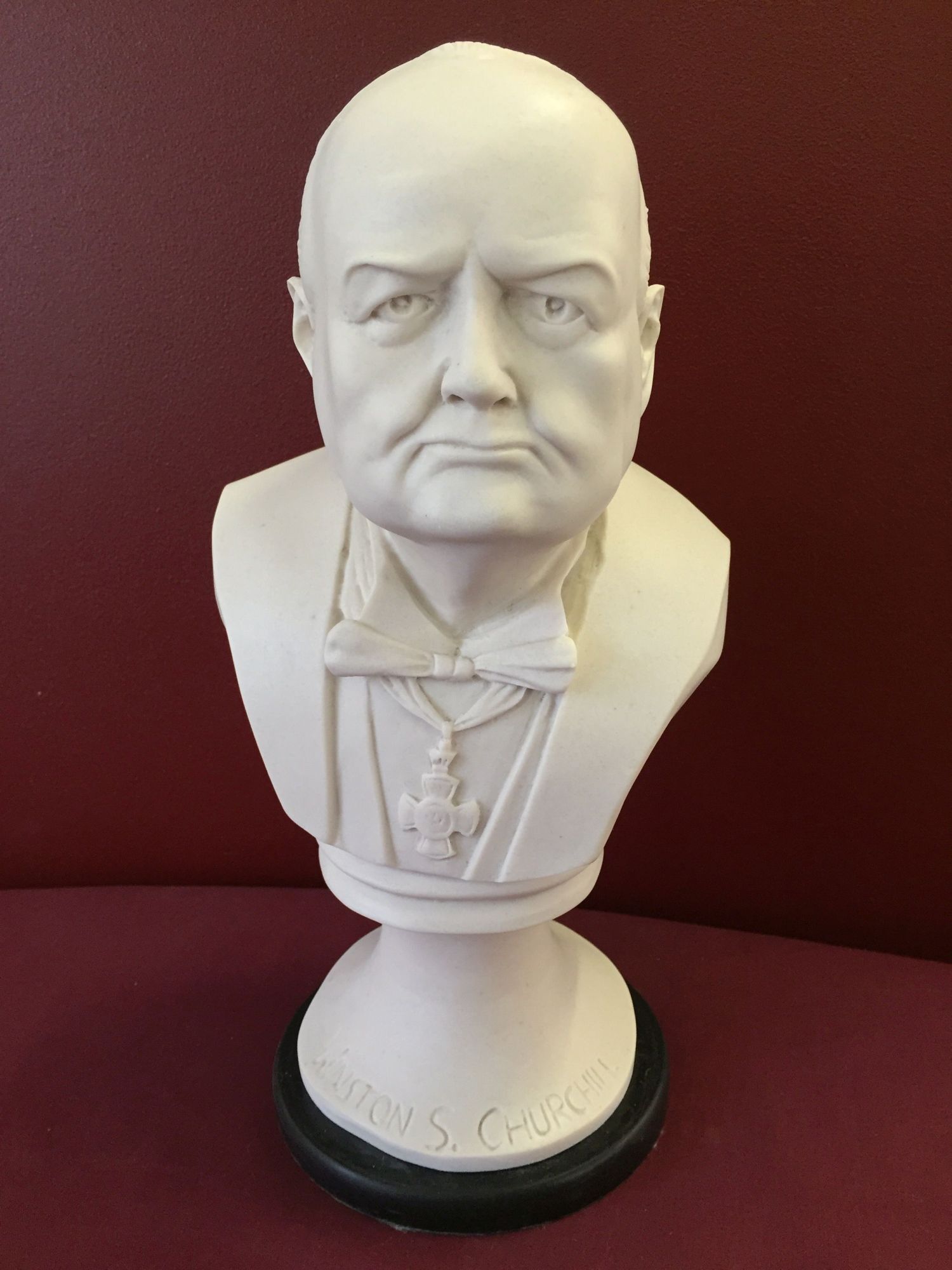 A white bust (believed to be re-constituted marble) of Winston Churchill (Approx 32cm high).
