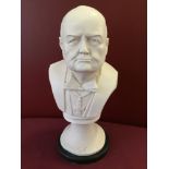 A white bust (believed to be re-constituted marble) of Winston Churchill (Approx 32cm high).