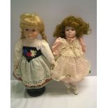2 bisque porcelain dolls.