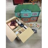 A wooden dolls house with working lights, doorbell and a large quantity of furniture & accessories.