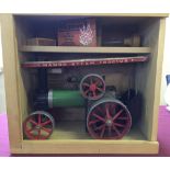 A wooden boxed Mamod steam tractor complete with fuel bricks