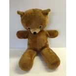 A very large brown teddy bear measuring approx 97cm long.