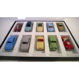 A display box of 10 Dinky cars to include: An MG Midget, A Sunbeam Alpine & a Austin Healey.