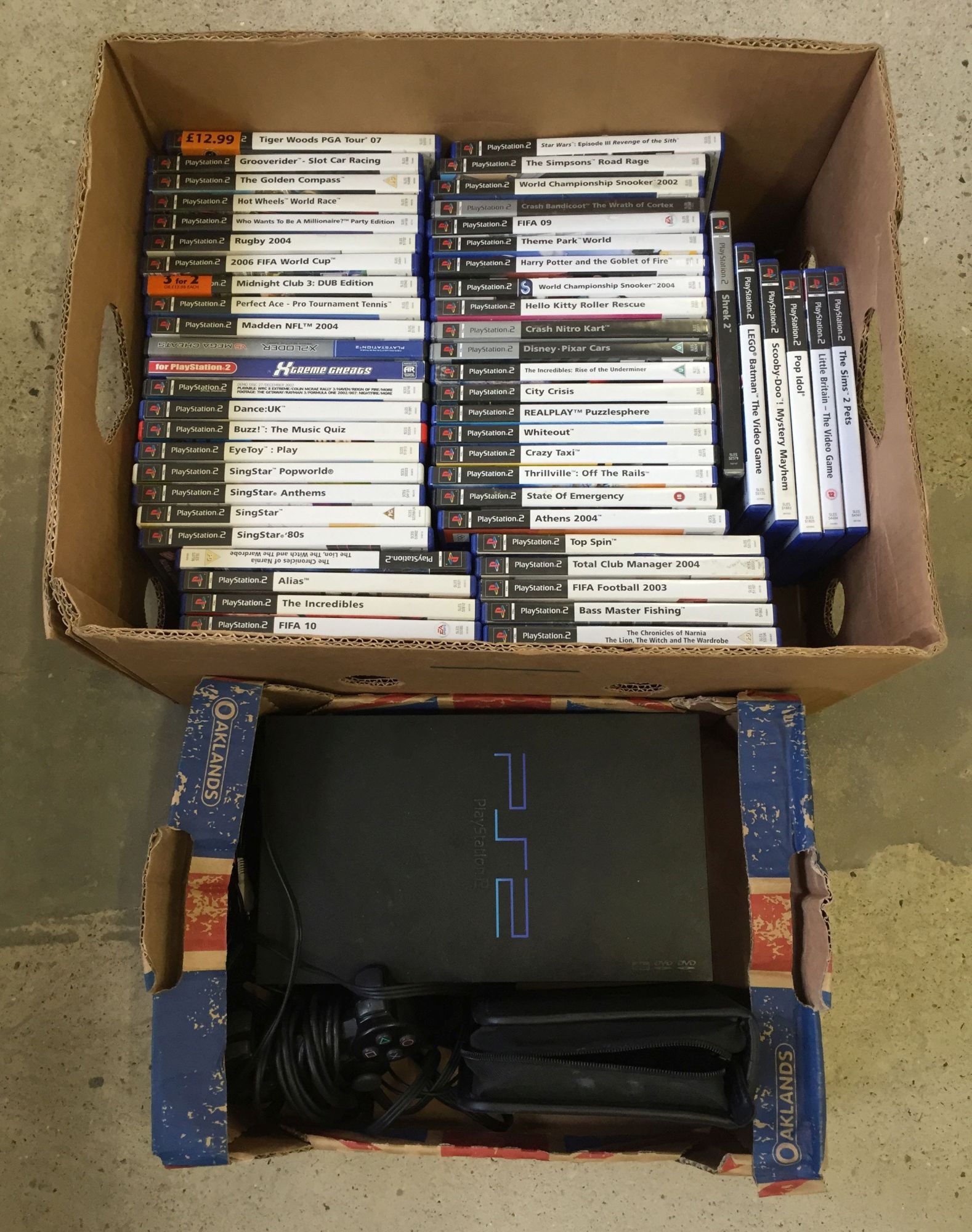 An unboxed PS2 original console together with controller, memory card, video leads (no power