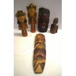 A small collection of Tribal wood carvings & masks.