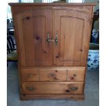 Pine cabinet with cupboard over 2 drawers. 134cm tall x 96cm wide x 56cm deep.