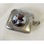 A silver vesta case with engraved pattern and enamelled plaque of a lady wearing a hat (hallmarked