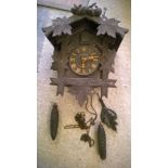 A vintage Black Forest wall mounted cuckoo clock.