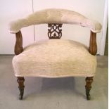 Victorian nursing chair with fretwork back & biscuit coloured upholstery, turned legs and brass