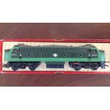 A boxed Tri-ang OO gauge BR green diesel locomotive (repainted).