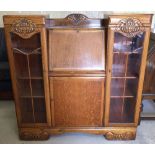 A light oak bureau bookcase with glazed doors (with keys).