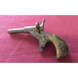 Vintage metal toy Deringer wooden handled gun. Marks on barrell 'Fritum'.