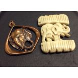 A carved bone elephant figure 3cm x 4cm, together with a vintage 3D copper elephant pendant,