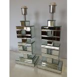 A pair of mirrored glass lamp bases (approx 50cm high).