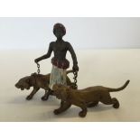 A cold painted bronze figure of an arab boy with 2 tigers (approx 11cm wide x 7cm high).