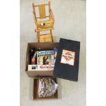 A quantity of toys and games to include Monopoly, vintage building bricks, and a dolls high chair.