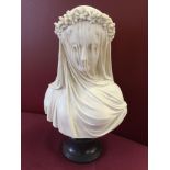 A white bust (believed to be re-constituted marble) of a veiled lady (approx 35cm high).