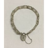 Silver 3 bar gate bracelet with 'padlock' clasp and safety chain.