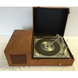 A Philips wooden cased vintage record player with built in speaker.