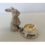 A silver plated salt with rabbit figure.