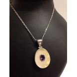 Large oval 925 silver pendant set with mother of pearl and a central oval amethyst. On a 16" fancy