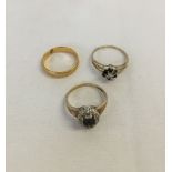 3 gold rings comprising a 22ct gold wedding band approx 3.2g and 2 9ct gold dress rings with missing