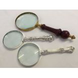 3 x magnifying glass. 2 silver plated handles and 1 wood & brass.